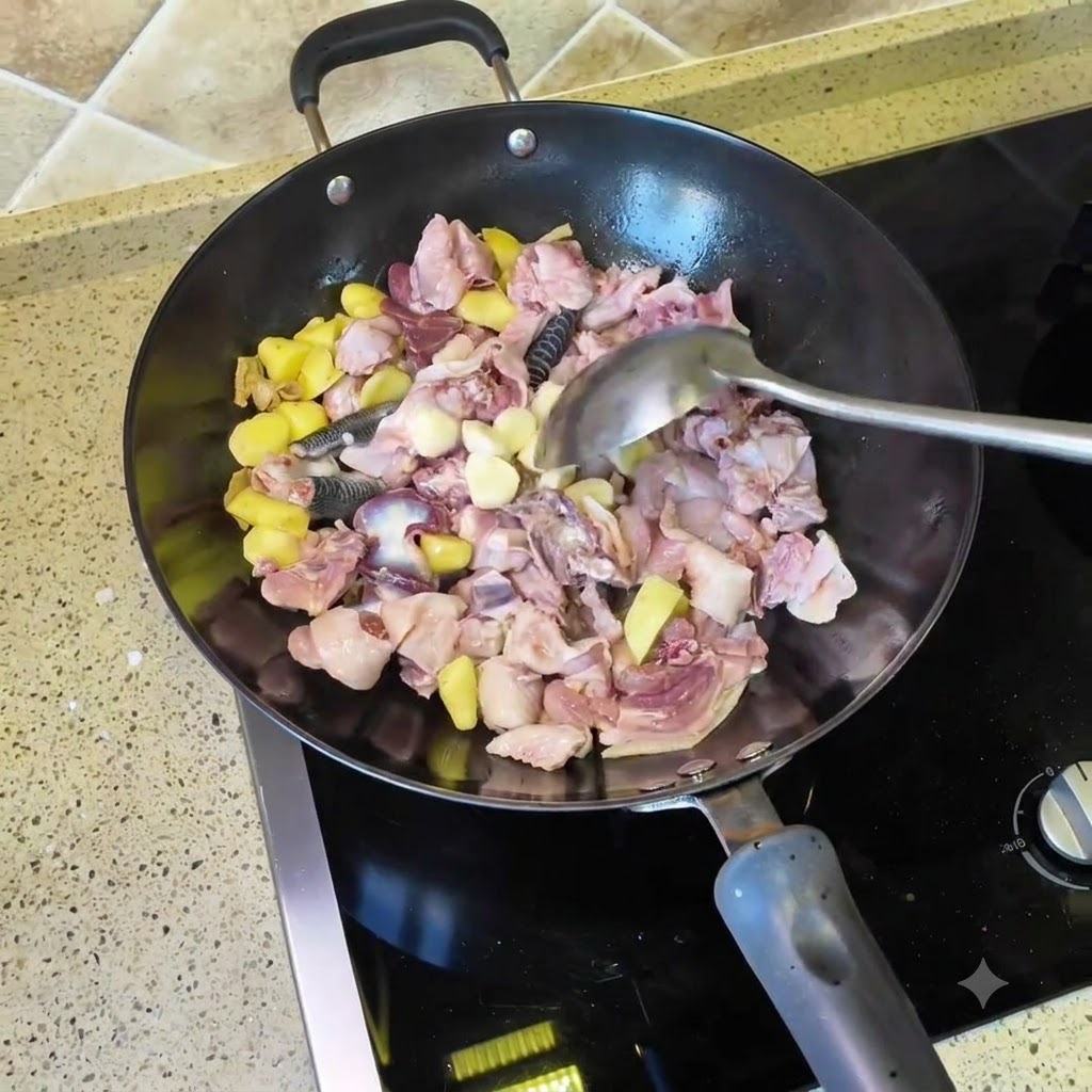 Ząbki czosnku i suszone papryczki chili wrzucane do woka z kawałkami kurczaka i imbiru.